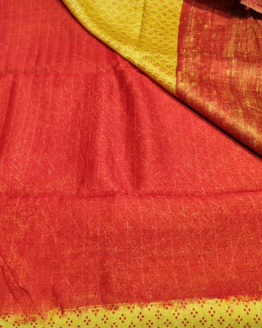 A close-up of a Tussar_Silk_Saree_Digital_Print_Yellow_Red_1 showing its woven texture, fine stripes, and dotted border details.