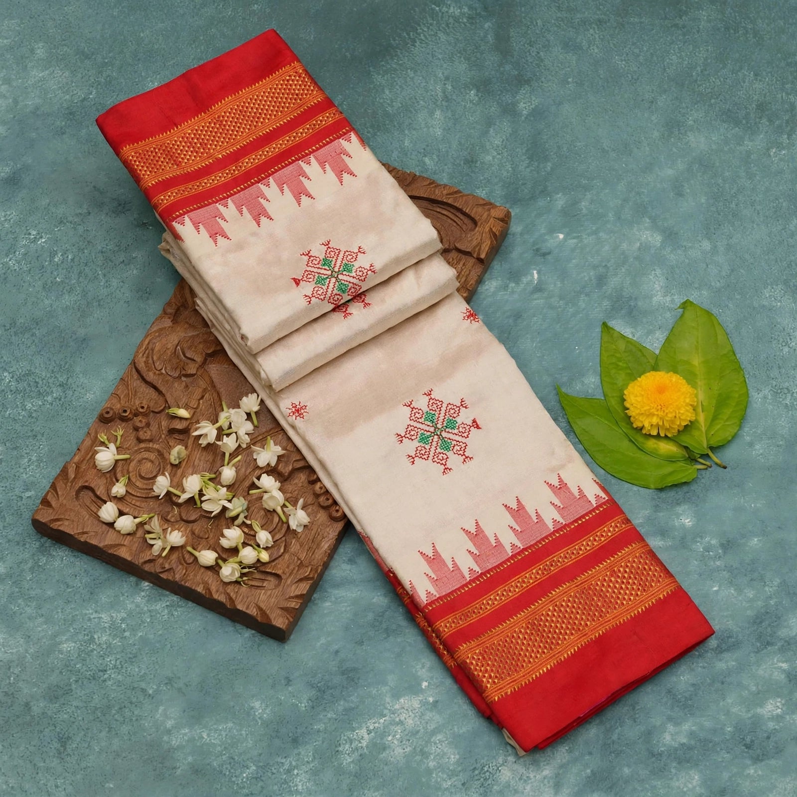 Closeup of Ilkal Silk saree in Off white cream and red with Kasuti inspired motifs