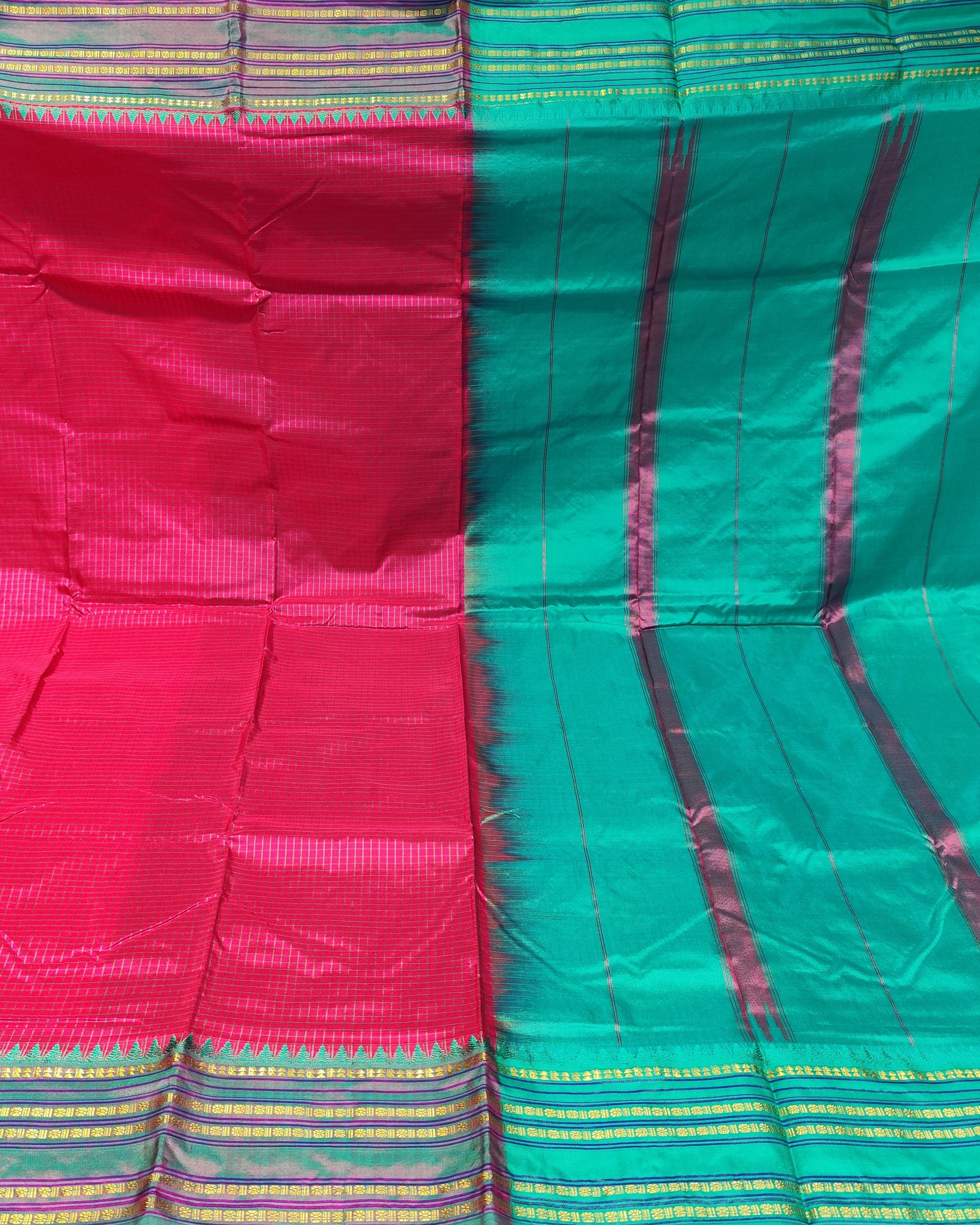 A Narayanpeth Saree Checks Pink shown in two large color blocks: bright pink on the left and teal-green on the right, with metallic gold and purple woven border stripes along the bottom and top edges.