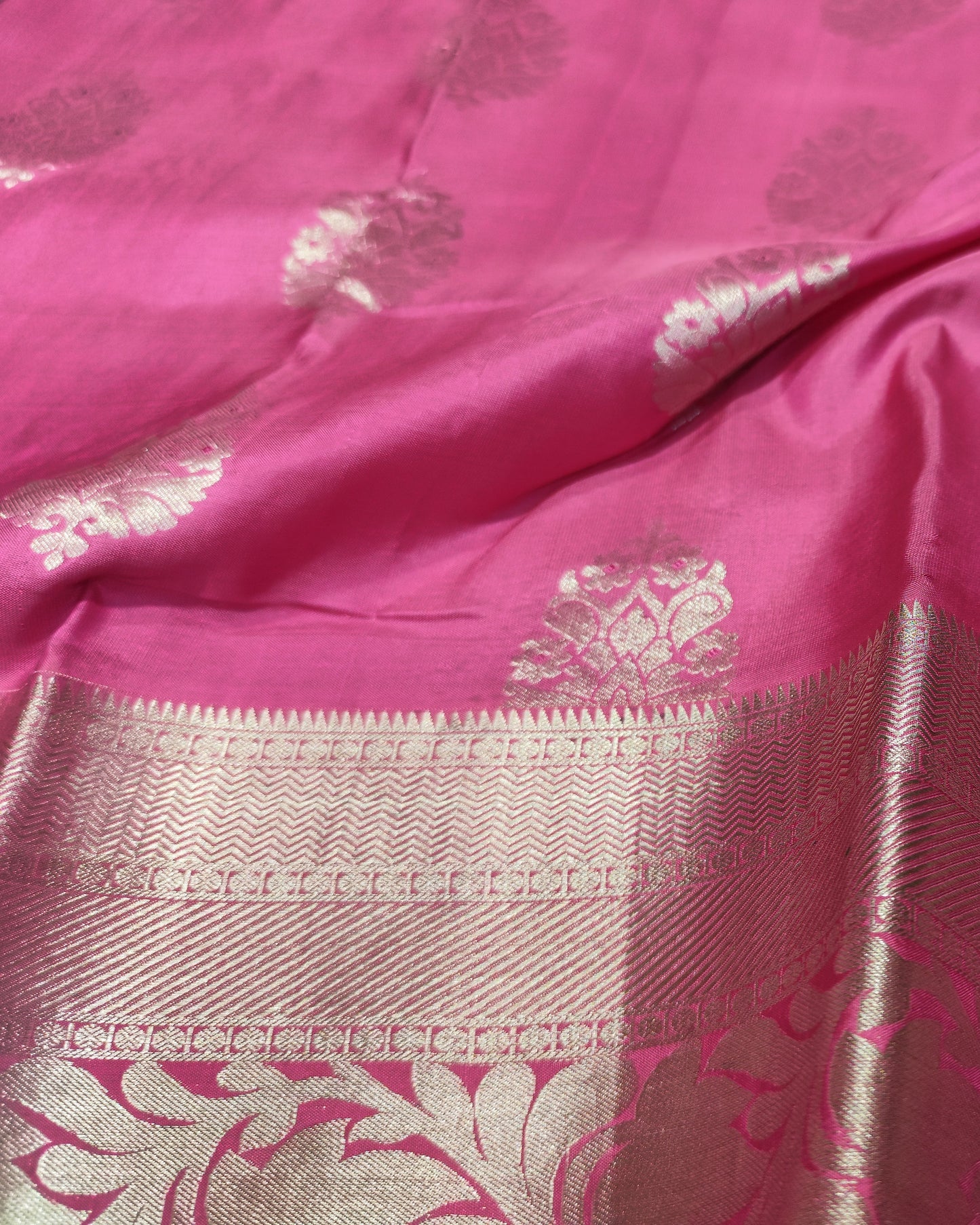 Pink & Cream Kanjeevaram silk saree with metallic gold zari floral motifs and a wide decorative gold border.